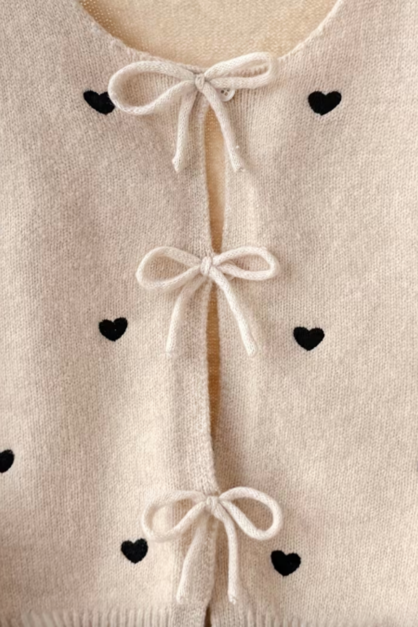 Beige Cardigan with Black Hearts